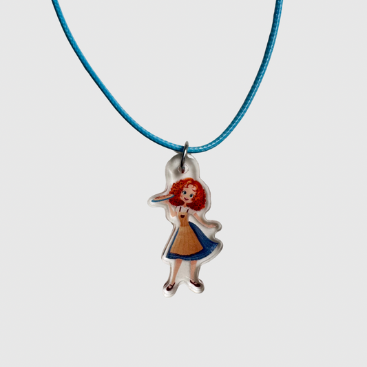 Necklace with a pendant of a girl in a dress on a white background