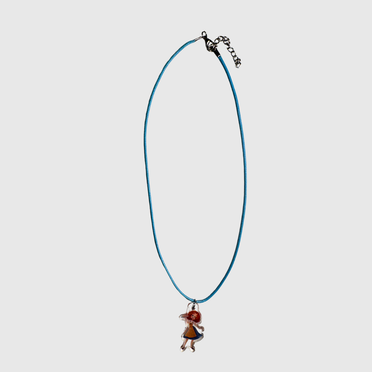 Necklace with a small pendant on a light gray background